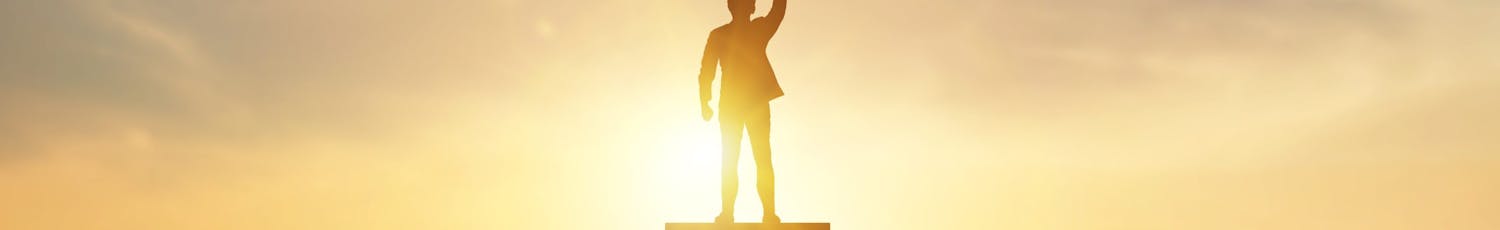 Silhouette,Of,Businessman,Holding,A,Trophy,On,Top,Staircase,With